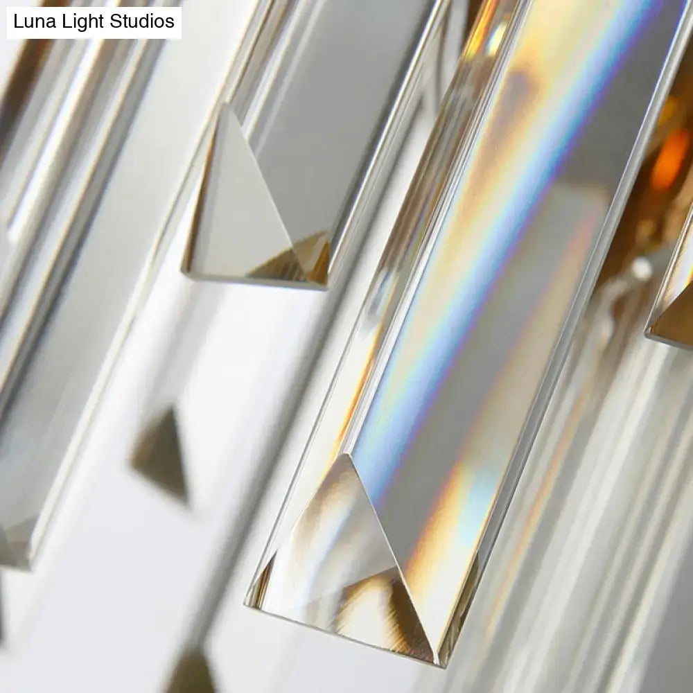 Modern gray and gold faceted crystal wall light fixture with prismatic rods refracting light for restaurants wall lamp