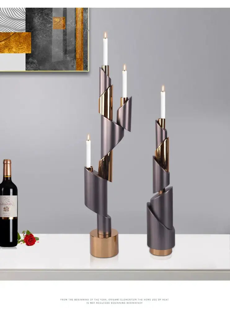 Two modern spiral helical pipe candle holders with metallic gray and gold finish for dining room decorbites geometric decor