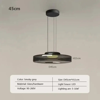 Modern gray and green tiered glass pendant light featuring a smoky grey glass pendant with black hardware suspension