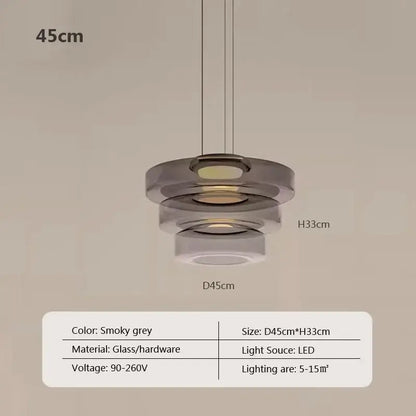 Modern gray and green tiered glass pendant light with smoky grey glass and led illumination for dining room