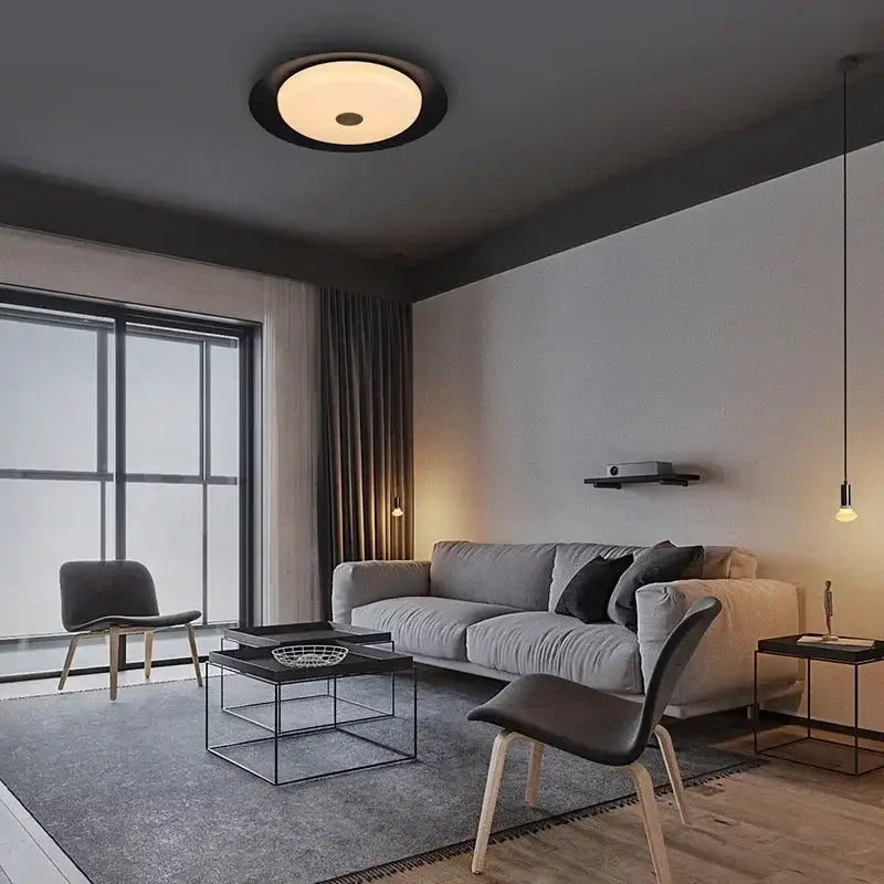 Modern gray leather platform bed bedroom led ceiling light with circular ceiling light featuring black ring and warm glow