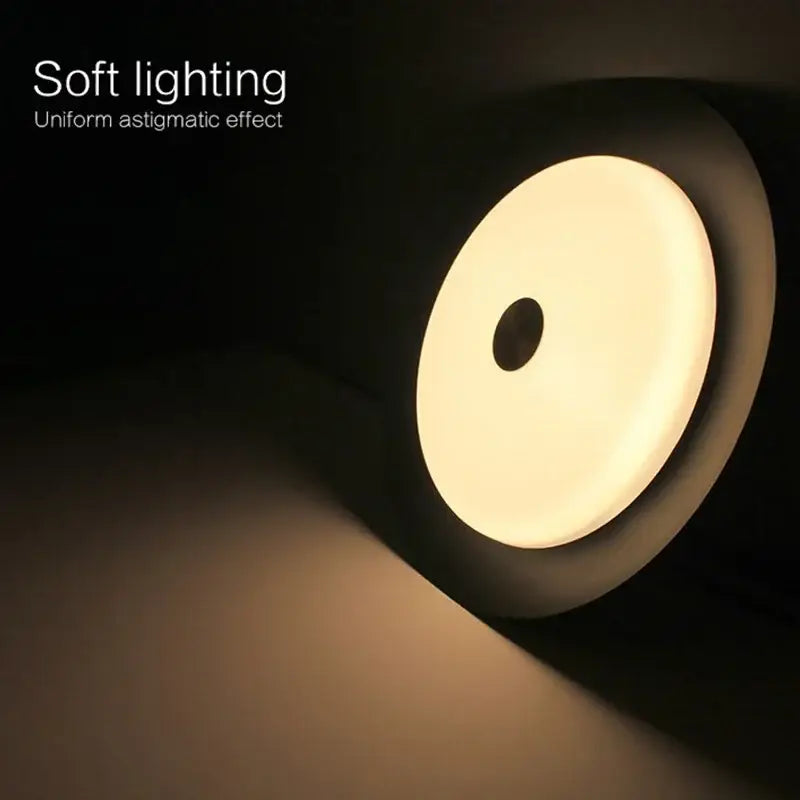 A sleek circular table lamp with a warm glow and black minimalist exterior complementing decorbites led ceiling light