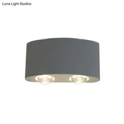 Modern gray metal piece cylindrical sconce lighting with two recessed led bulbs for living room ceiling use
