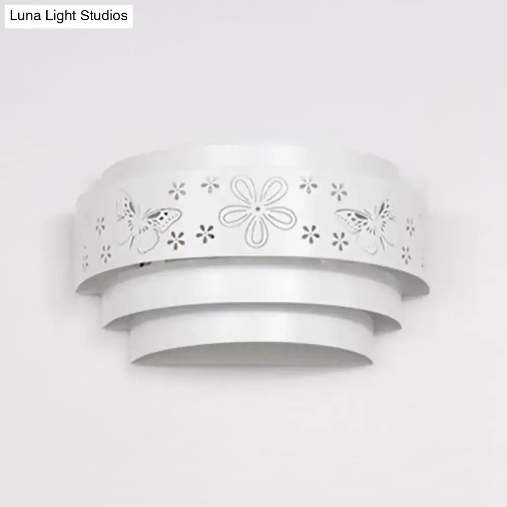 Modern gray metal living room wall sconce with white layered design and delicate butterfly and flower cutouts