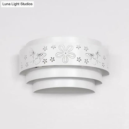 Modern gray metal living room wall sconce with white layered design and delicate butterfly and flower cutouts