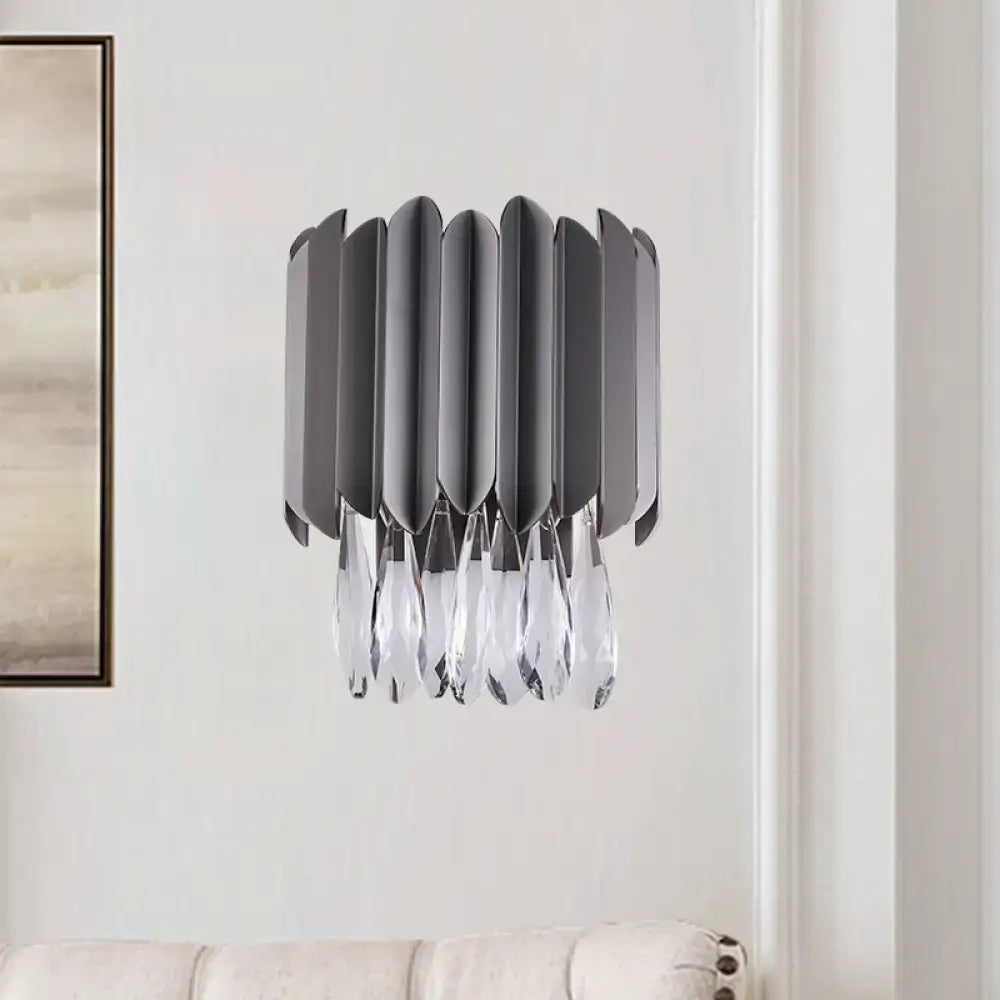 Modern gray metallic wall sconce with cascading crystal teardrop droplets for bedroom lighting