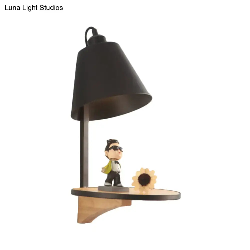 Modern gray tapered shade wall sconce with wooden shelf featuring black bell-shaped desk lamp sunflower and cartoon figurine