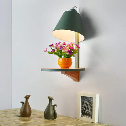 Modern gray tapered shade wall sconce with green conical lamp and wooden shelf for bedroom lighting