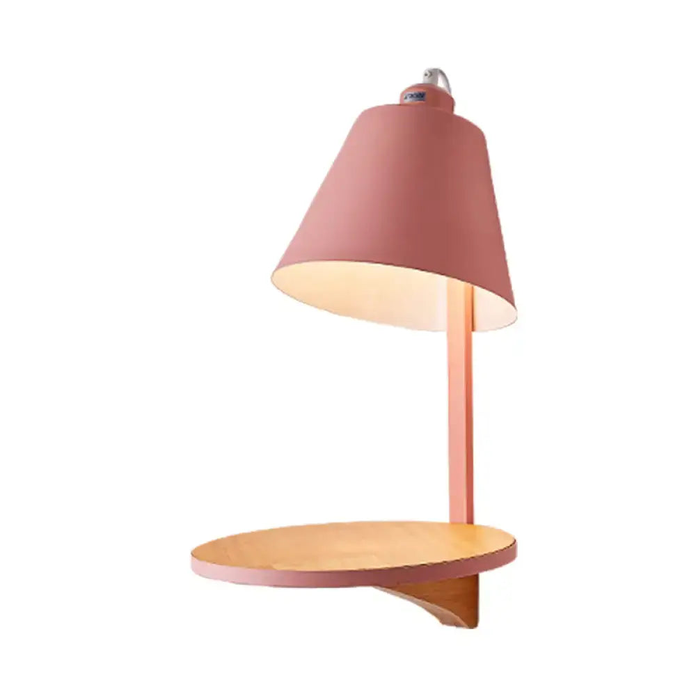 Pastel pink metal desk lamp with wooden circular shelf complements modern gray tapered shade wall sconce bedroom light