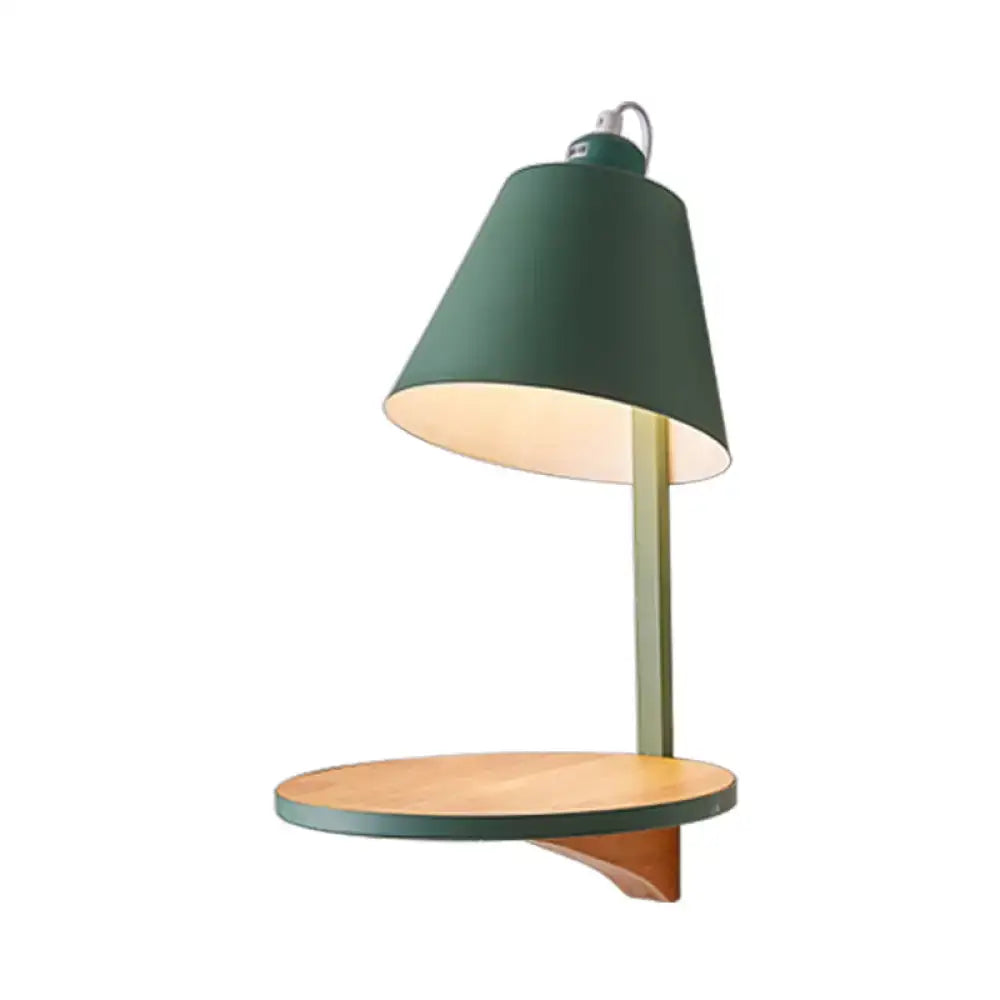 Green metal desk lamp with wooden shelf complementing modern gray tapered shade wall sconce bedroom light