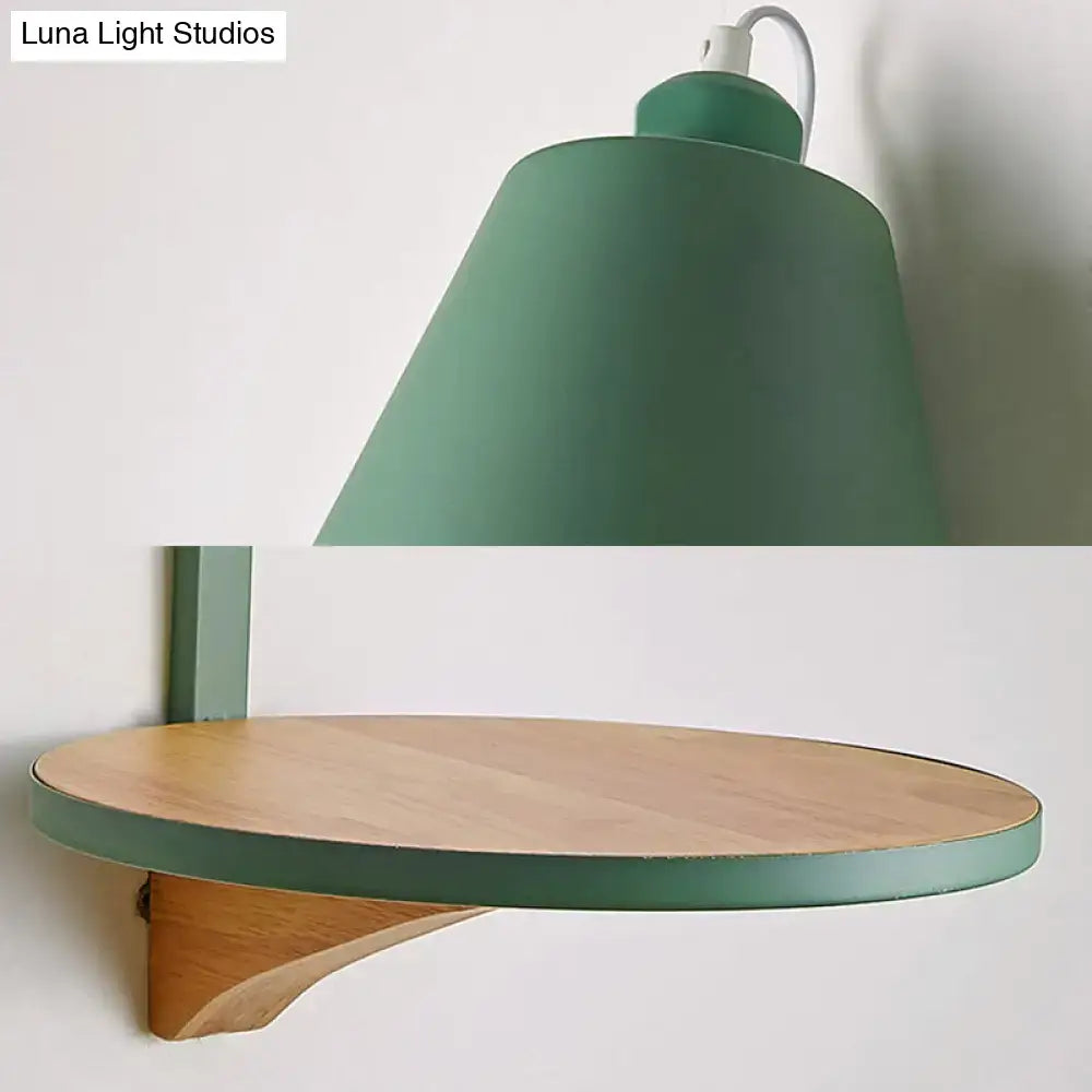 Modern gray tapered shade wall sconce with green matte wall-mounted lamp and matching wooden circular shelf below