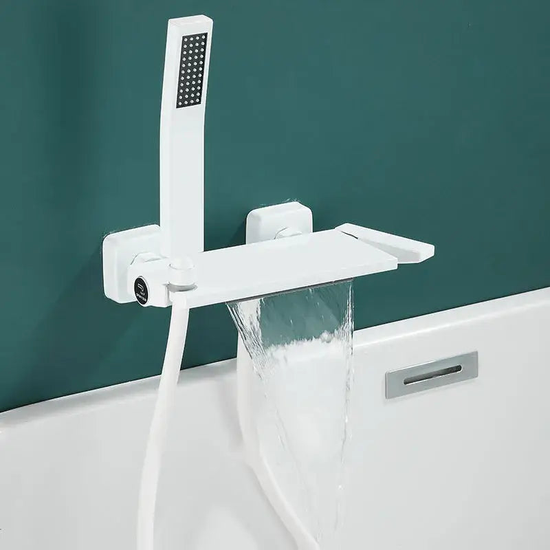 Modern gray wall mounted faucet set featuring a white minimalist bathtub faucet with integrated waterfall spout and handheld showerhead