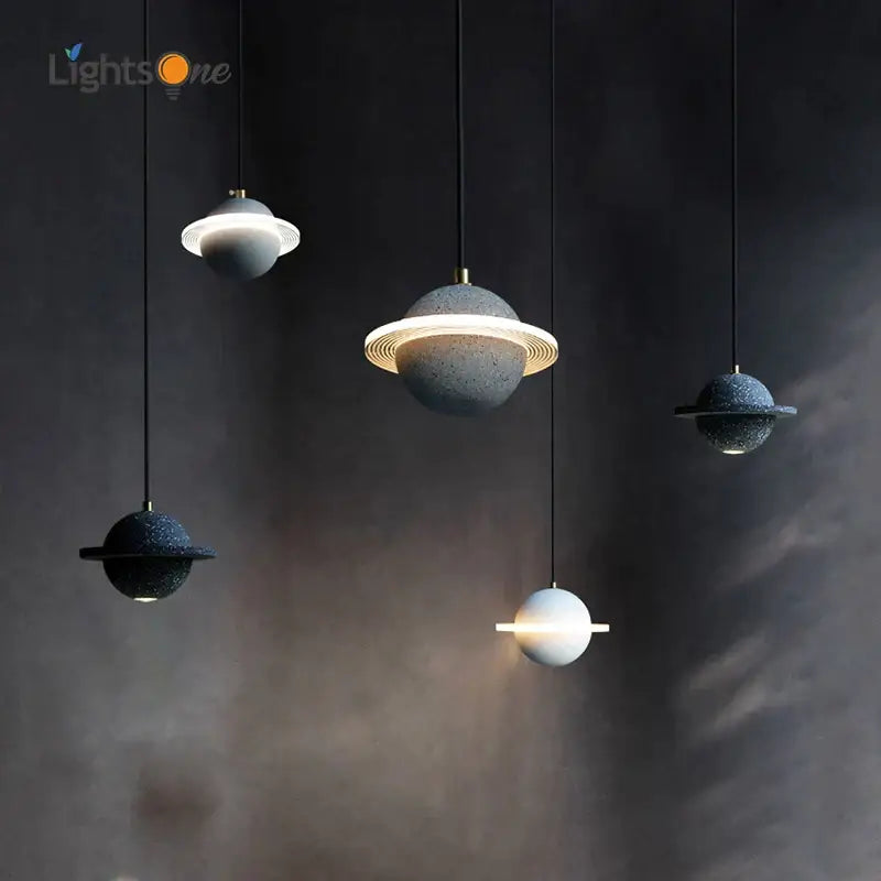 Sleek gray and white cement planet pendant light with textured spheres and glowing rings for modern bedroom decorbites decor