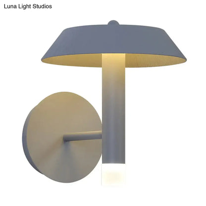 Modern gray and white wall sconce with matte dome shade and warm LED light type featuring a bulb base design