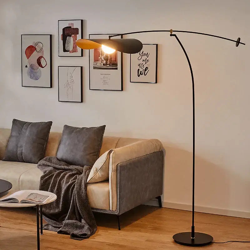 Modern black floor lamp with curved arm and dual-toned shade complementing decorbites adjustable led pendant chandelier