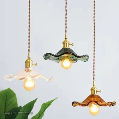 Three hanging glass pendant lights with brass fixtures translucent green and amber colorful glass for dining room cord pendant installation