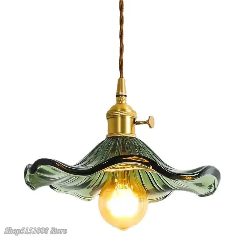 Vintage-style pendant light with translucent green ruffled glass shade and brass finish for colorful glass cord pendant installation