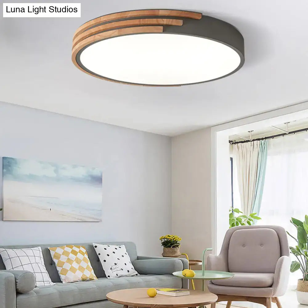 Modern round flush mount ceiling light with dark metal frame and concentric wooden slats by decorbites in grey and white