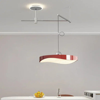 Modern red and white pendant light chandelier with sleek curved design and metallic arm for dining room lighting