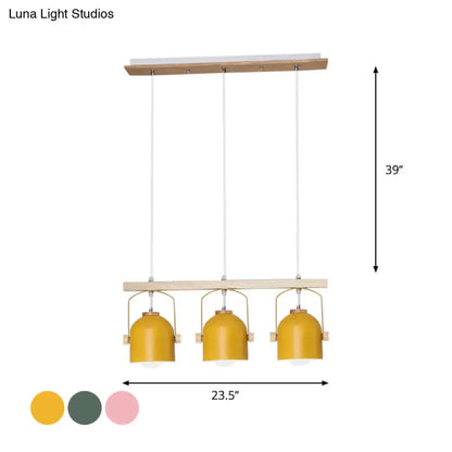 Decorbites nordic dome island light with three mustard-yellow metal shades hanging from a natural wood frame