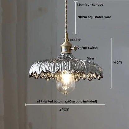 Vintage-style pendant light with textured silver glass shade and brass fittings for modern green glass walnut dining room