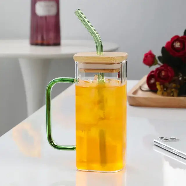 Modern green handle square glass mug with a bamboo lid and straw for kitchen drinking use