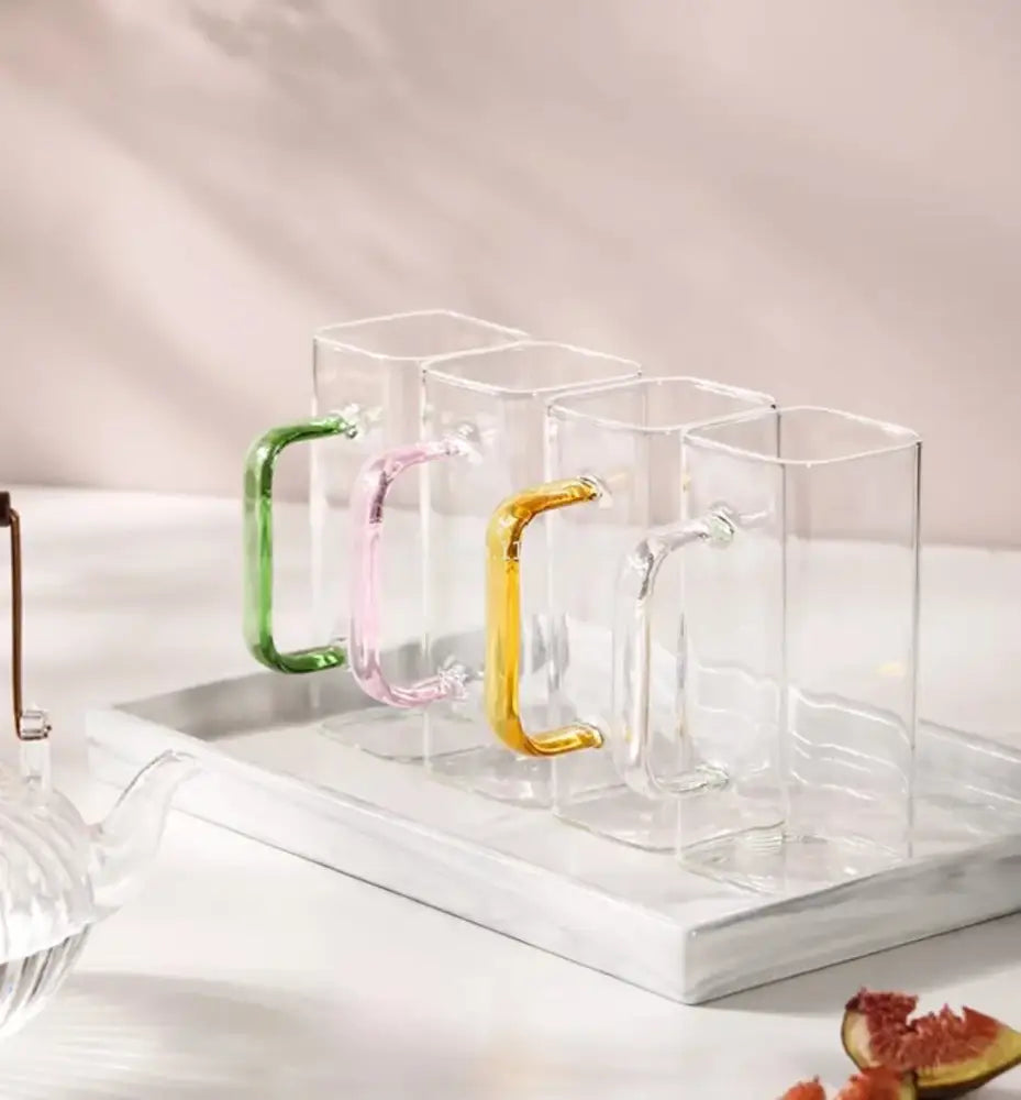 Modern green handle square glass mug with colorful handles in green pink and yellow for kitchen drinking use