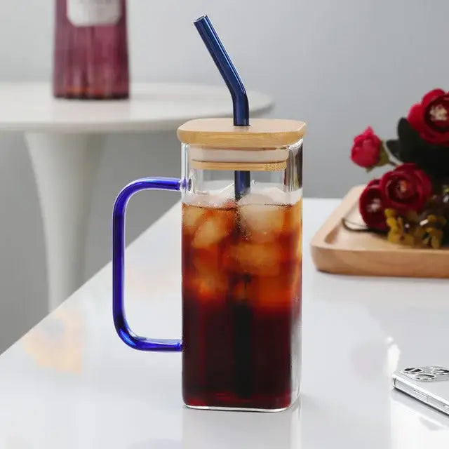 Modern green handle square glass mug featuring clear glass with blue handle and bamboo lid for kitchen drinking use