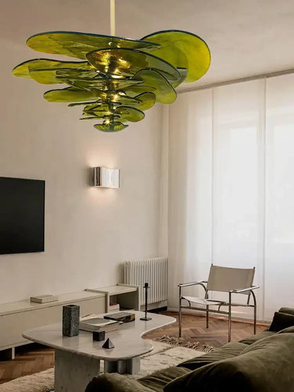 A modern green leaf glass chandelier with layered translucent olive-green petals for dining room ceiling light