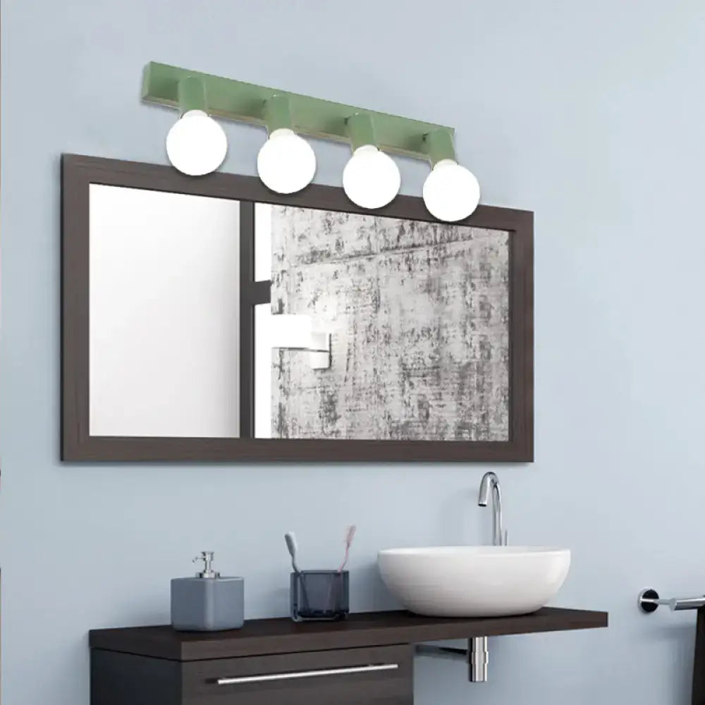 Green linear vanity light with four white spherical bulbs for modern bathroom vanity mirror lighting solutions
