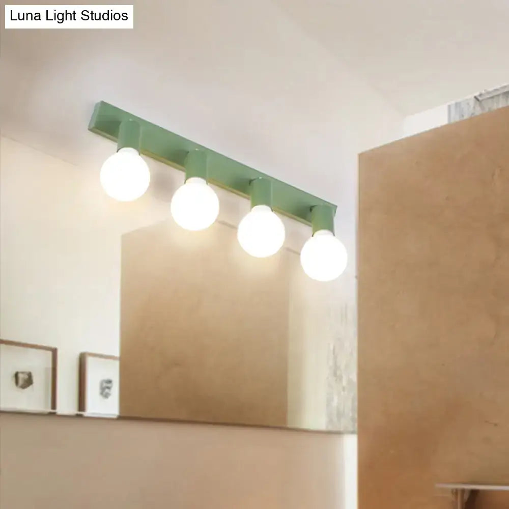 Modern green linear vanity mirror light fixture with four white spherical bulbs for bathroom wall sconce lighting