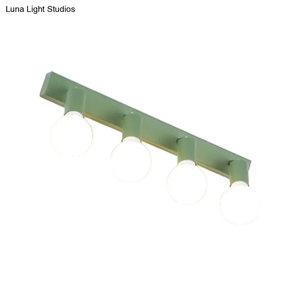 Modern sage green linear vanity mirror light metal wall sconce with four frosted glass globe bulbs for bathroom use