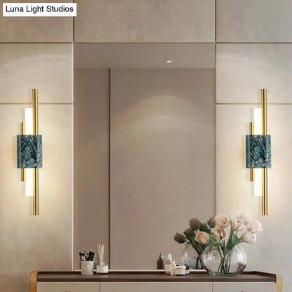 Modern green marble and gold wall sconce light featuring teal marble inlays and vertical led stick light bars for bedroom decor