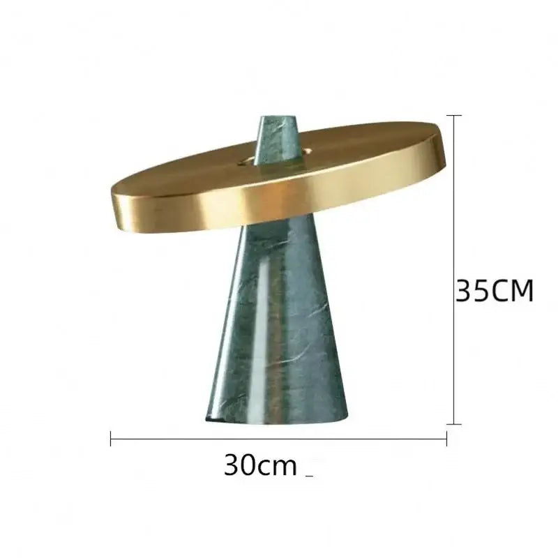 Modern green marble table lamp with gold shade featuring a polished gold top and dark green marble cone base decorbites green marble