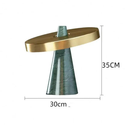 Modern green marble table lamp with gold shade featuring a polished gold top and dark green marble cone base decorbites green marble