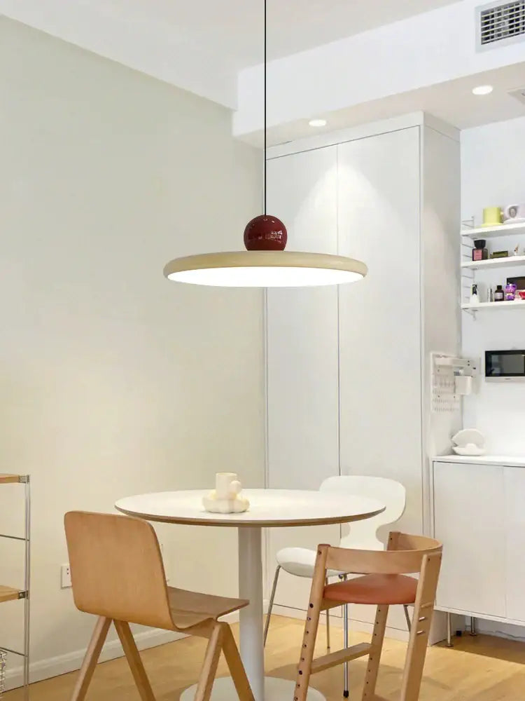 Modern pendant lights with sleek white circular shade and glossy red spherical accent for kitchen decorbites colorful metal led design