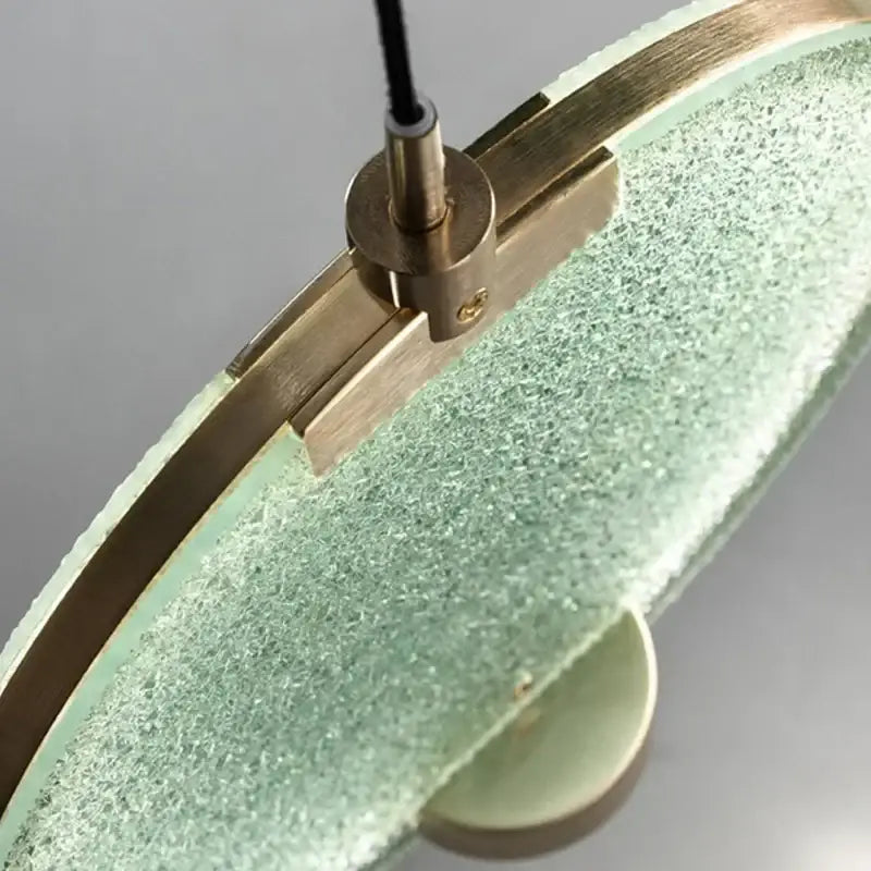 Modern green textured glass brass pendant light with translucent mint shade and brushed brass hardware for dining room decorbites brass pendant
