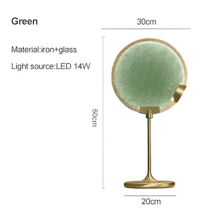 A sleek green glass vanity mirror with a brass-finished iron stand and led light complements decorbites brass pendant light decor