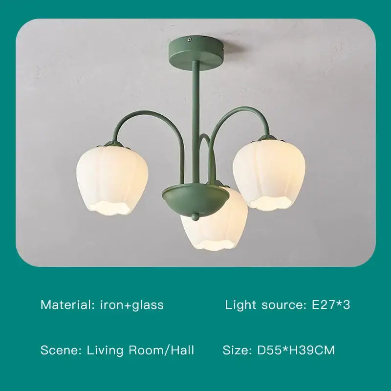 Modern green white chandelier with glass and iron frame featuring three bell-shaped frosted glass shades for living room