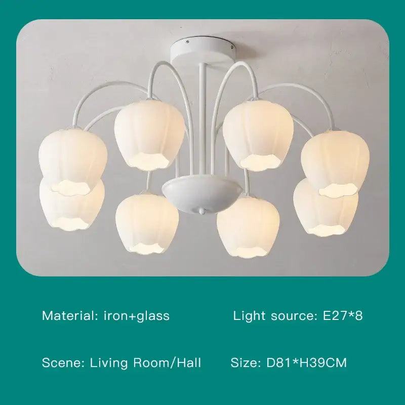 White chandelier ceiling light with six pear-shaped glass shades and iron arms for modern green white living rooms