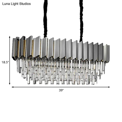 Modern grey crystal pendant chandelier with sleek metallic frame and cascading clear prisms for kitchen island