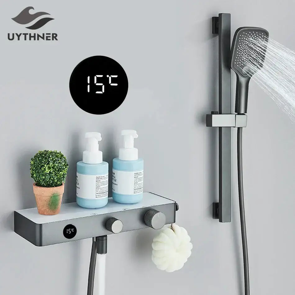 Black digital shower temperature display mounted on wall above shelf in modern grey digital shower faucet set for bathroom
