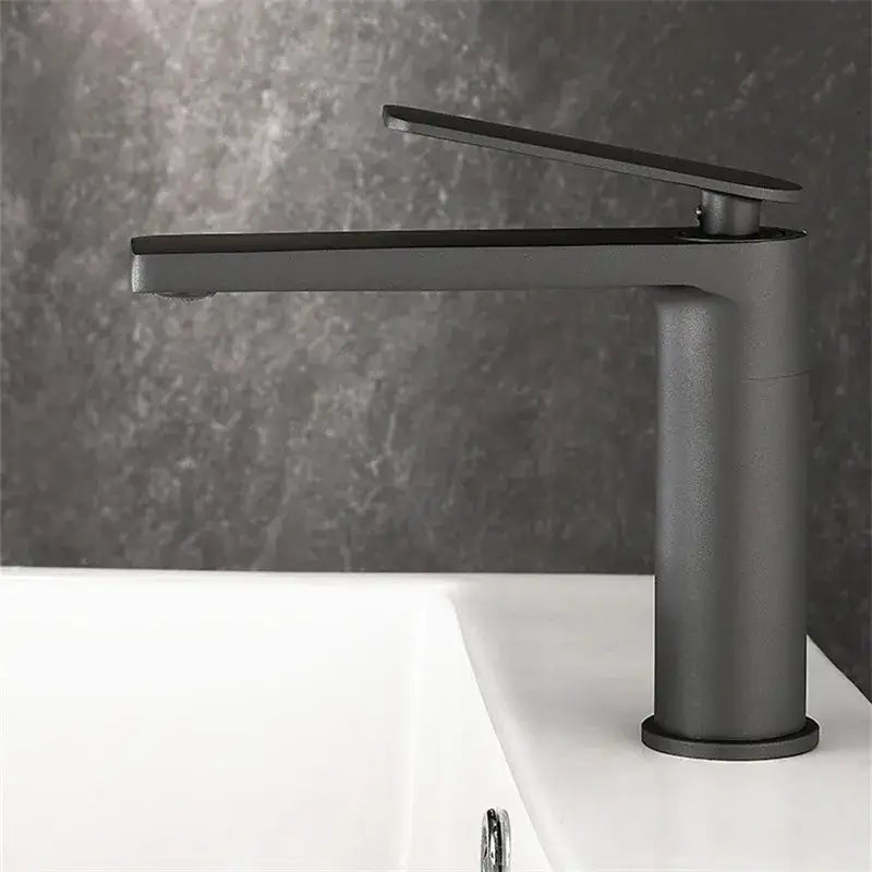 Modern gun gray basin faucet with matte black finish and sleek cylindrical base for bathroom decorbites gun gray tap