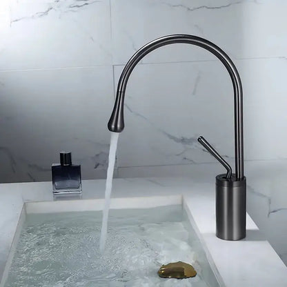 Modern gun grey brass basin faucet with a sleek matte black curved spout and cylindrical base for kitchen use decorbites gun grey