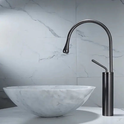 Modern gun grey brass basin faucet with a matte black sleek curved spout and cylindrical base for kitchen use decorbites