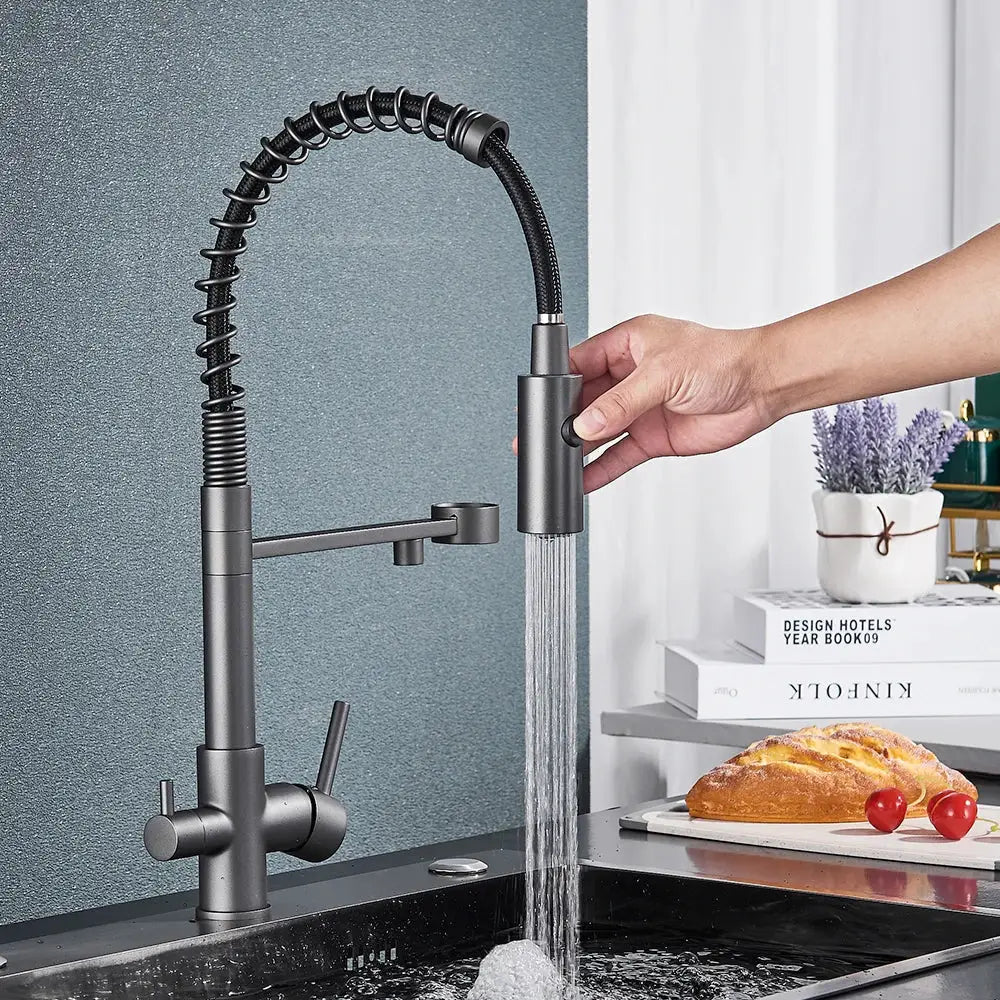 Modern gun grey filter kitchen faucet with pull down spring spout features a matte black flexible coiled hose design decorbites gun grey