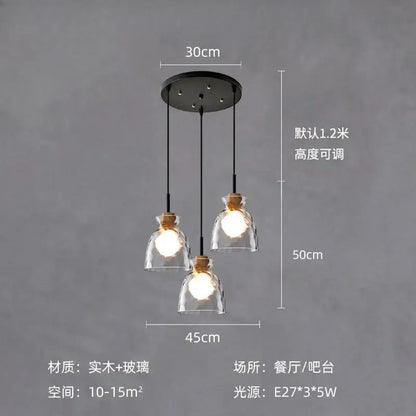 Modern hammered clear glass pendant lamp with three clear glass shades, wooden collars, and black cords for kitchen decorbites clear glass lighting