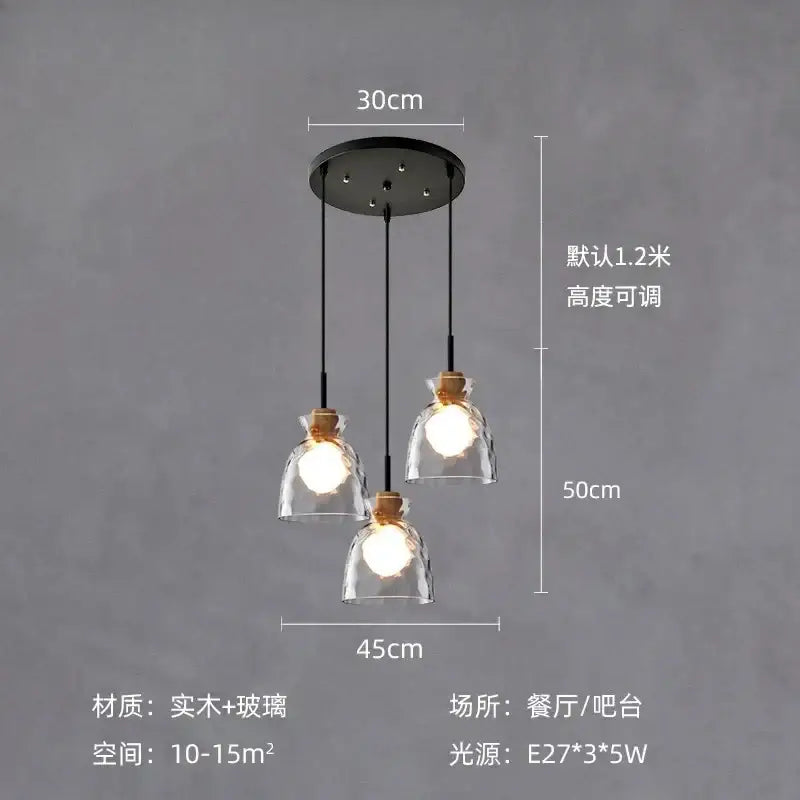 Modern hammered clear glass pendant lamp with three clear glass shades, wooden collars, and black cords for kitchen decorbites clear glass lighting