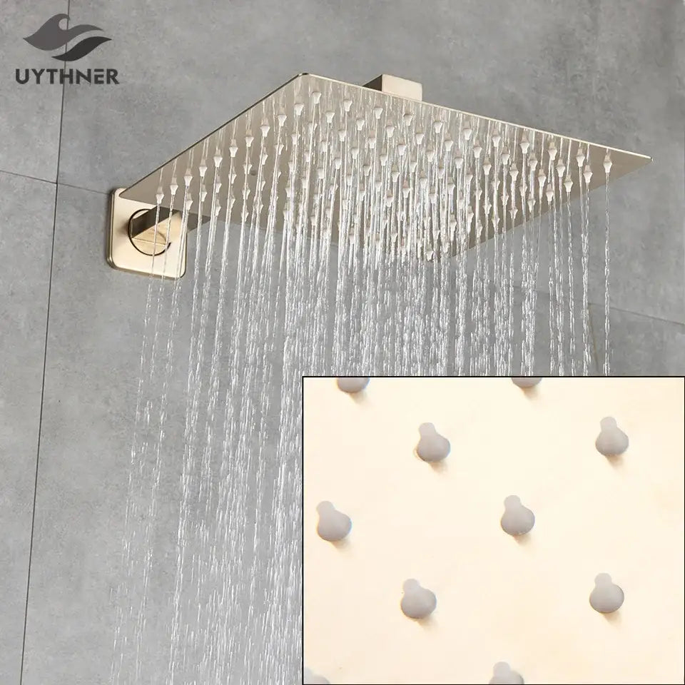 Modern hammered square wall mounted shower head in brushed nickel with multiple jets and matching control knob for bathroom use