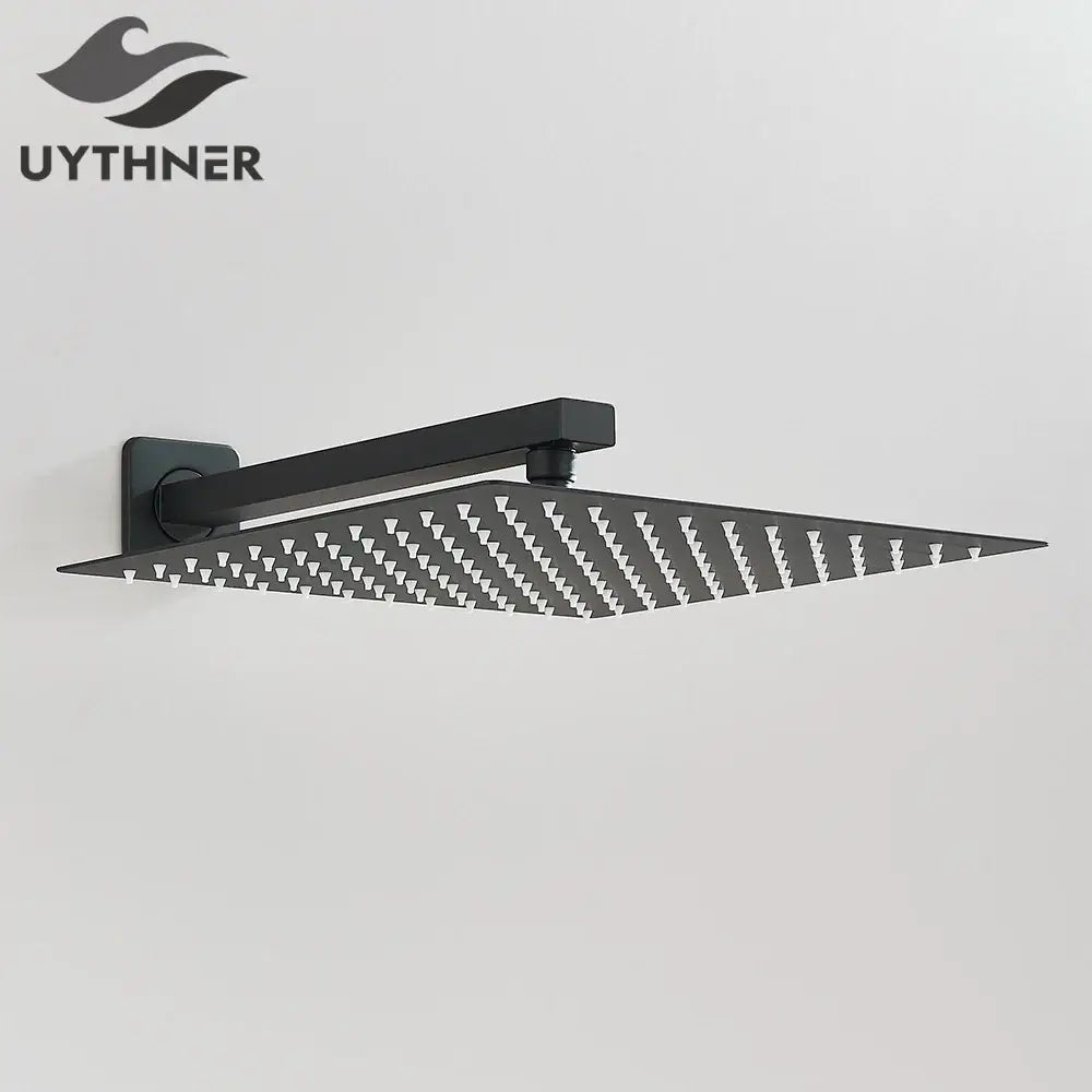 Black matte-finish modern hammered square wall mounted shower head with patterned spray nozzles for bathroom use
